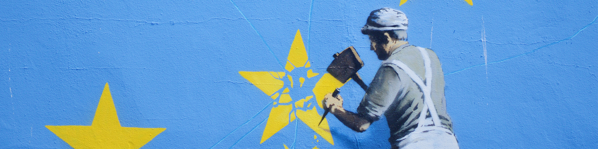 Banksy street art man removing EU star
