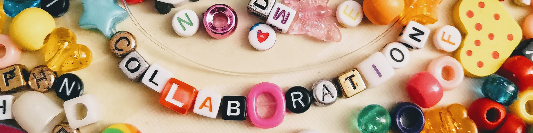 Beads spelling out 'Collaboration'
