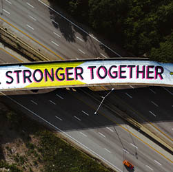Graffiti saying 'stronger together'