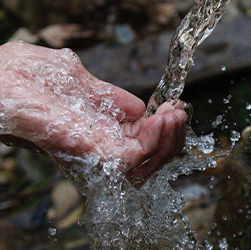 Water on a persons hand
